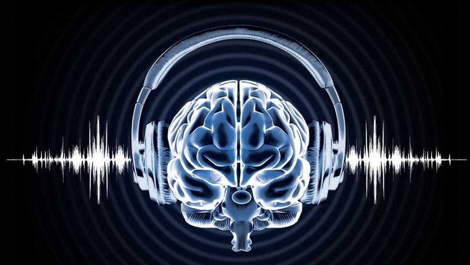 Human Brain wearing over-ear headphones with an audio waveform running behind it.